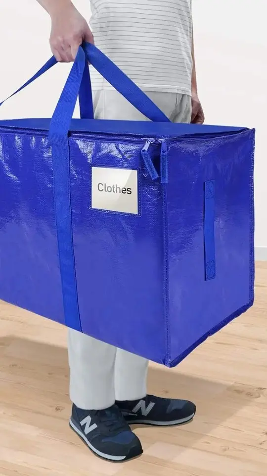 Placeholder thumbnail for “Packing a Whole Closet in 2 Moving Bags”. Final creator footage is not uploaded yet.